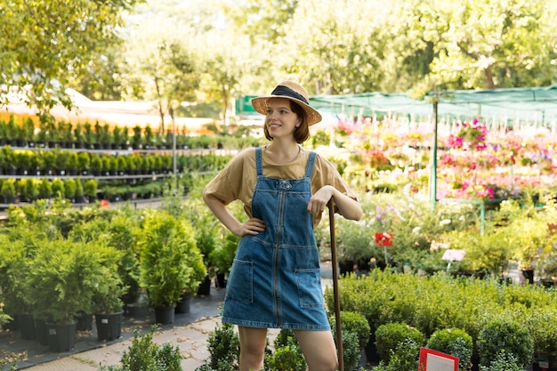 Female farmer working alone in her greenhouse