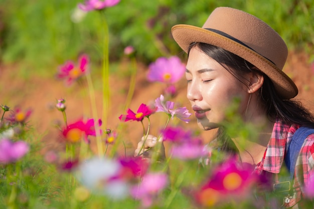 Female farmers are admiring the flower garden.