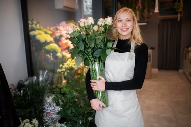 Female florist making a beautiful arrangement of flowers