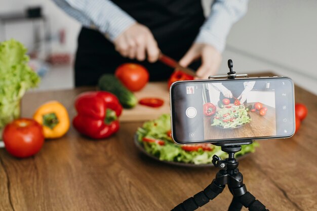 female food blogger streaming at home while cooking