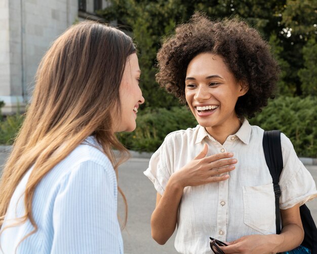 Female friends chatting outdoors