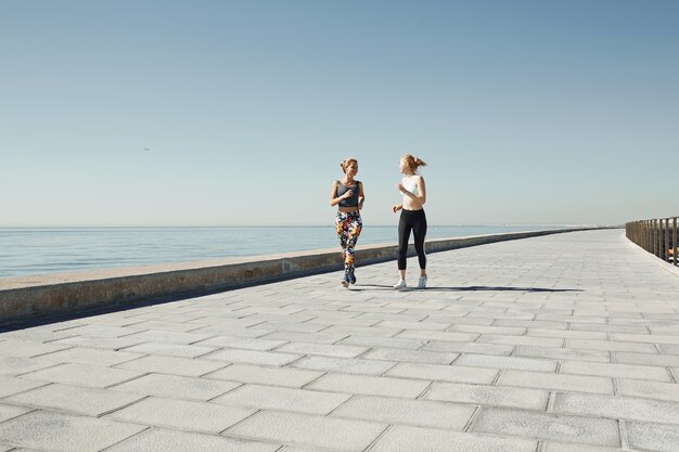 Female friends jogging together