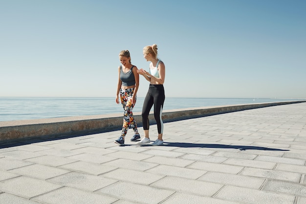 Female friends jogging together