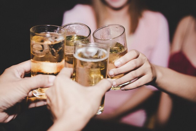 Female Friends with glass beer in a party