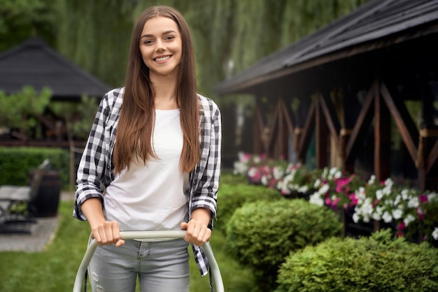 Free photo female gardener holding handle