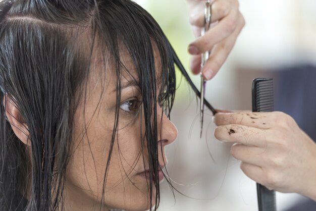 Female getting a haircut in a beauty salon