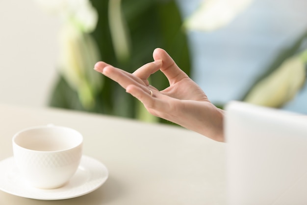 Female hand in chin mudra yogic gesture