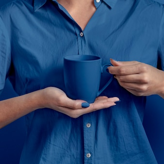 Female hand holding cup