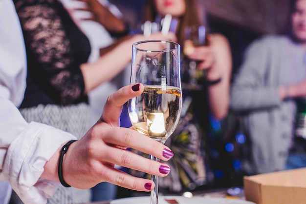 Female hand with champagne