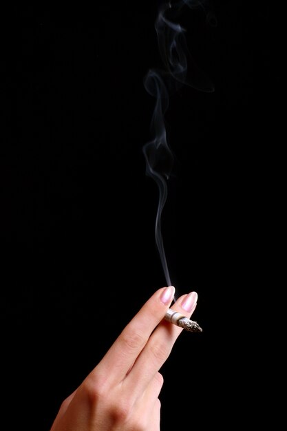 female hand with cigarette