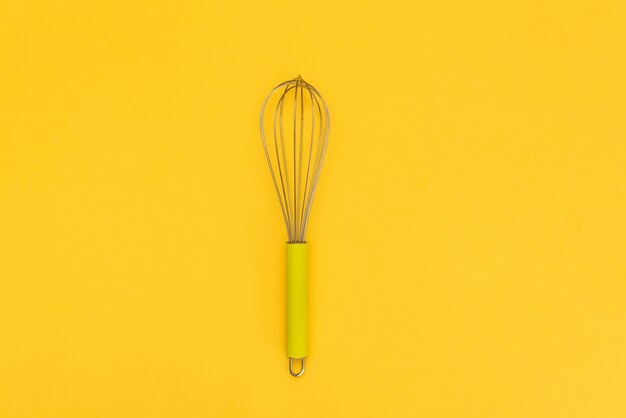 Download Premium Photo Female Hand With A Kitchen Whisk On Yellow Background Yellowimages Mockups
