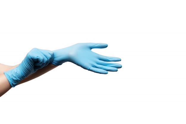 Female hands in disposable gloves on white background.