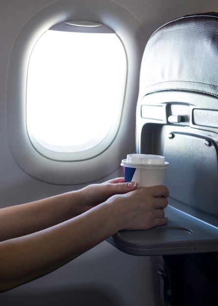 Female hands holding a coffee