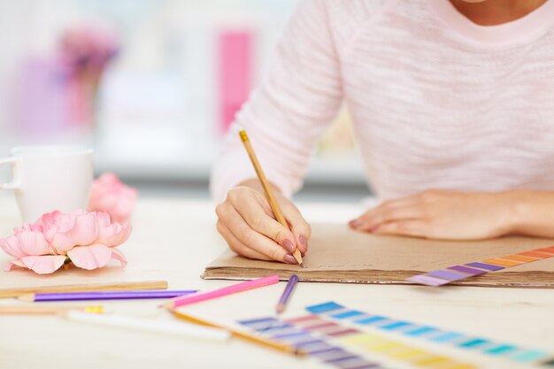 Female hands taking notes