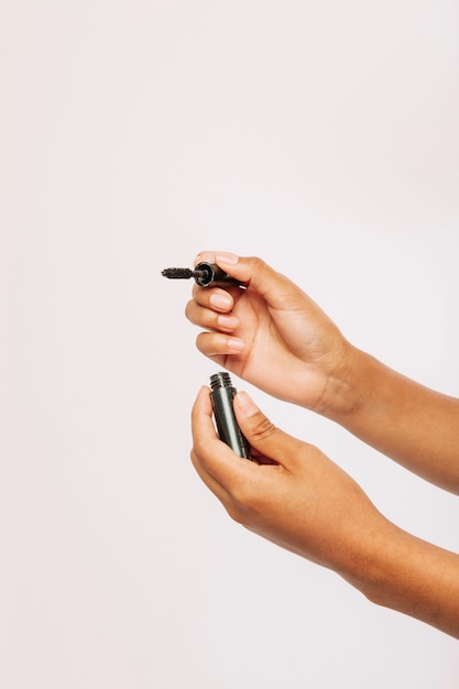 Female hands with eye make up