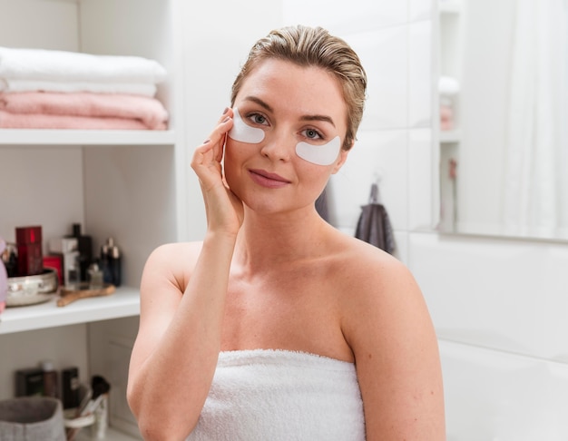 Female having under eye bags treatment patches