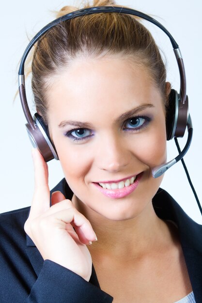 Female in headset looking at camera