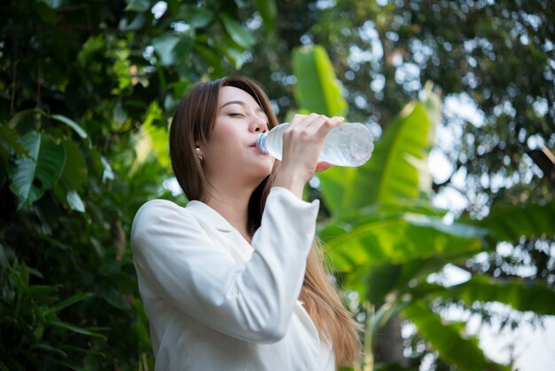 female healthy pretty mineral drinking