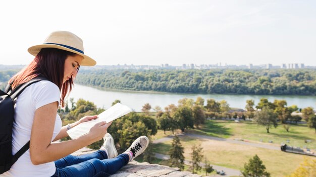 Female hiker looking in map at outdoors