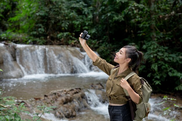 Female hikers take pictures of themselves