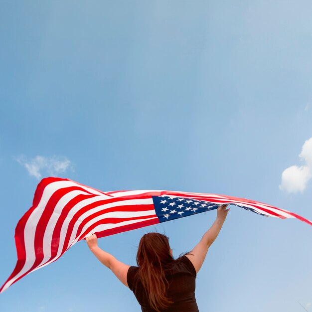 Female holding American flag