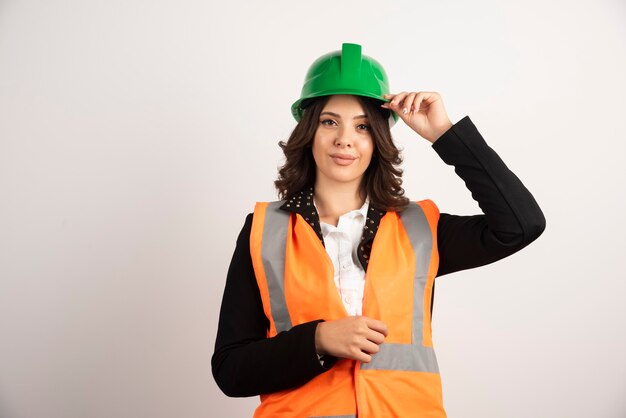 Female industrial worker posing on white