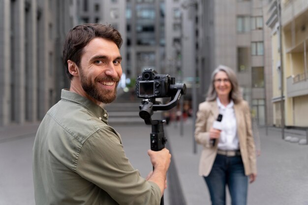 female journalist with her cameraman
