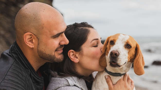 Free photo female kissing dog