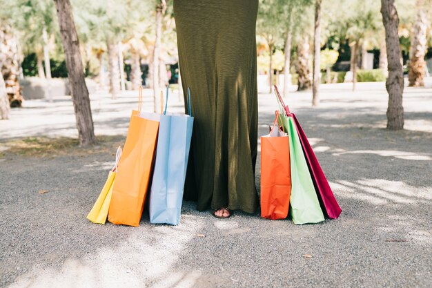 Female legs with shopping bags on the floor