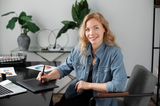 Female logo designer working on a graphic tablet