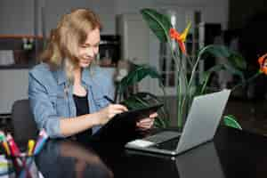 Free photo female logo designer working in her office