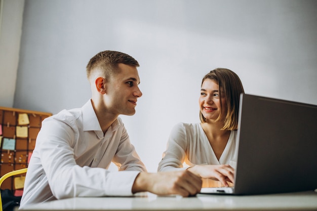 Female and male collegues working in office