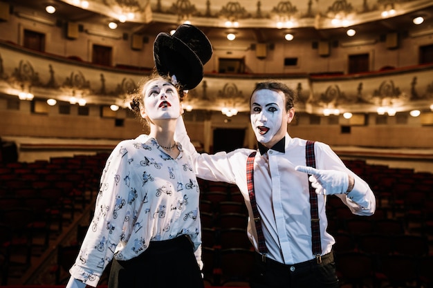 Free photo female and male mime artist performing on stage