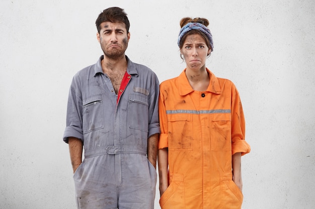 Free photo female and male workers wearing work clothes