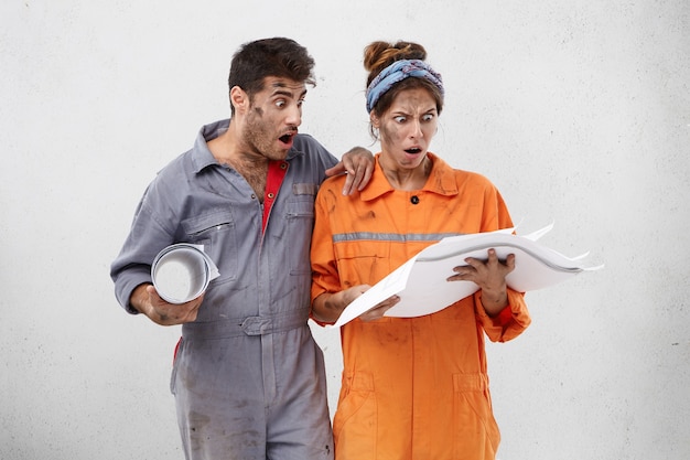 Free photo female and male workers wearing work clothes