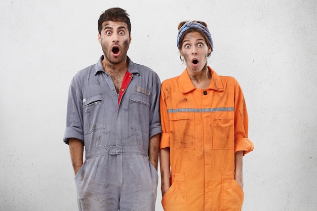 Free photo female and male workers wearing work clothes