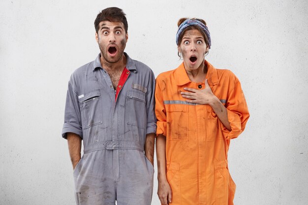 Female and male workers wearing work clothes