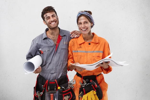 Female and male workers wearing work clothes