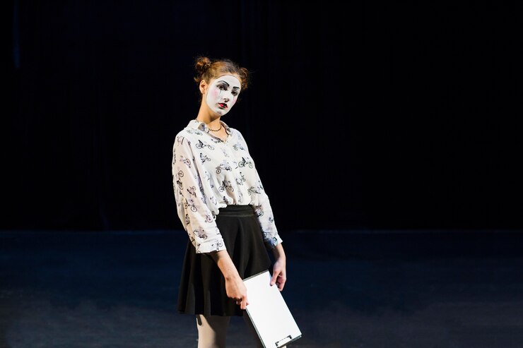 Free Photo female mime with manuscript looking at camera