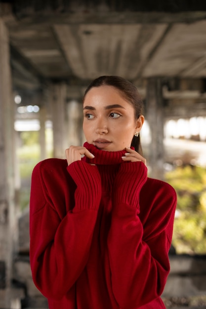 Female model being photographed with grunge environment during urban exploration