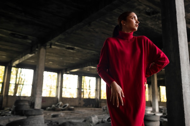 Female model being photographed with grunge environment during urban exploration