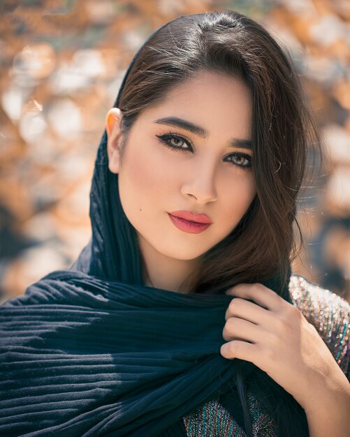 Female model in black oriental hijab