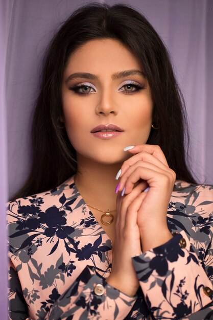 Female model in blue floral spring shirt and light makeup