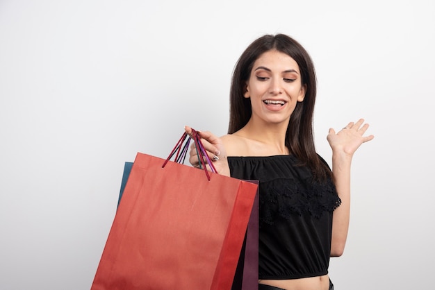 Female model holding shopping bags