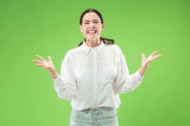 Female model isolated on green wall