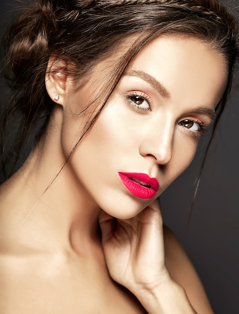 Female model with fresh daily makeup with red lips