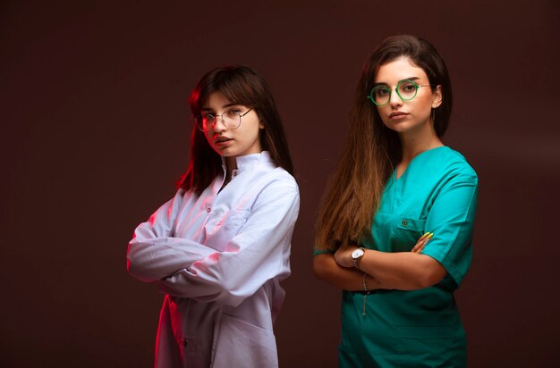 Female nurse and doctor look professional and confident.