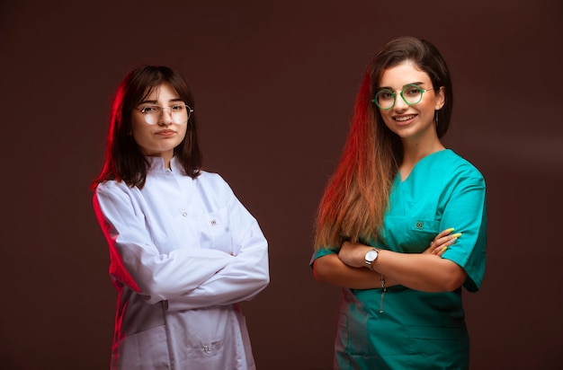 Free photo female nurse and doctor look professional and smiling.