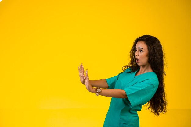 Female nurse trying to prevent danger