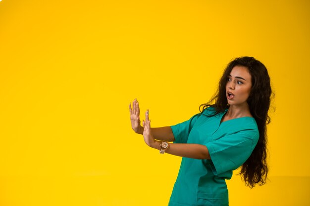 Female nurse trying to prevent danger.